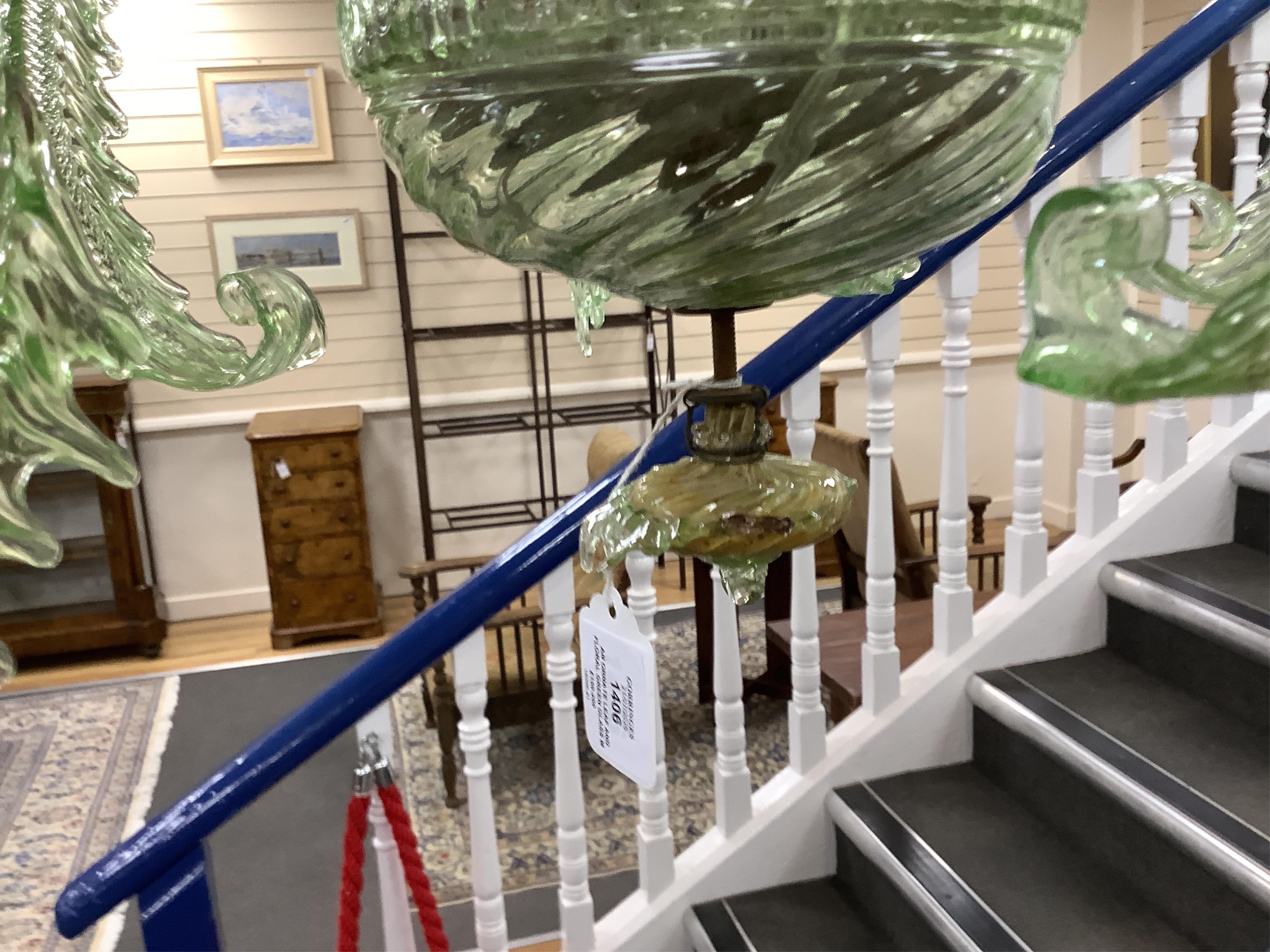 An ornate leaf and floral green glass Murano three branch chandelier, 84cm high.